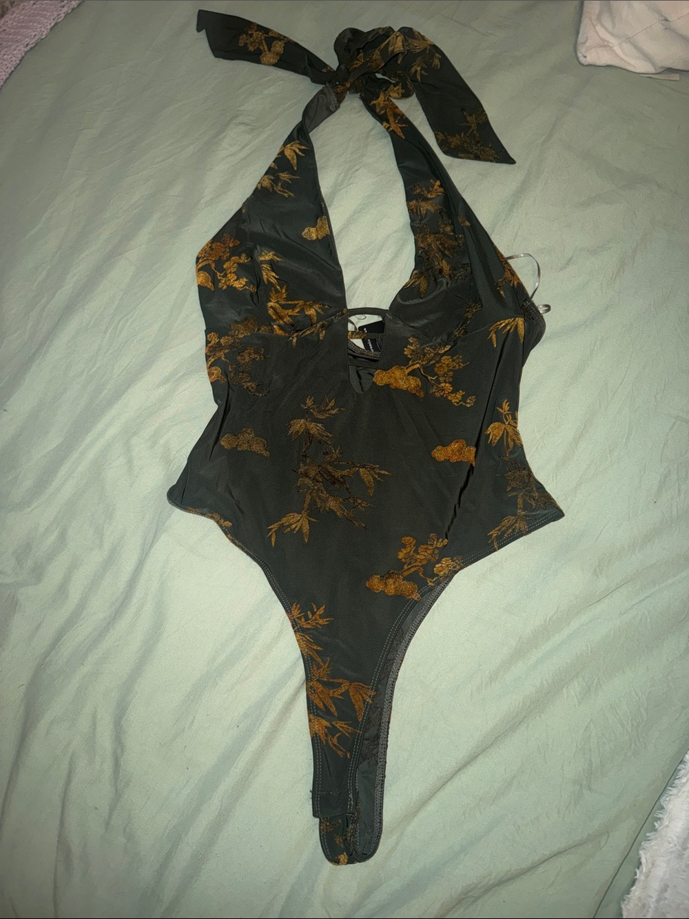 Woman’s  One-Piece Halter bodysuit in Dark Green with Mustard Floral